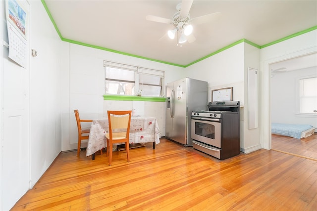 124-01 9th Ave, College Point, NY 11356 - kitchen with appliances with stainless steel finishes, light wood finished floors, and ceiling fan
