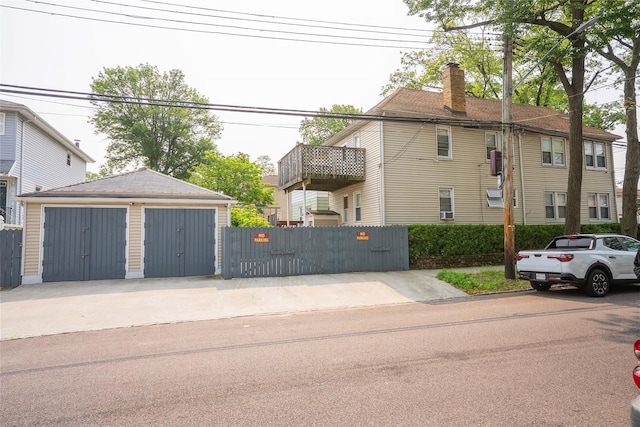 124-01 9th Ave, College Point, NY 11356 - view of property exterior with a garage, an outbuilding, and a chimney