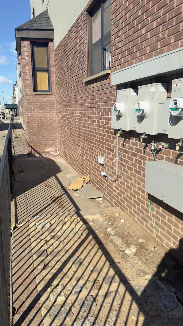 32 Radde Pl, Brooklyn, NY 11233 - view of side of home featuring brick siding
