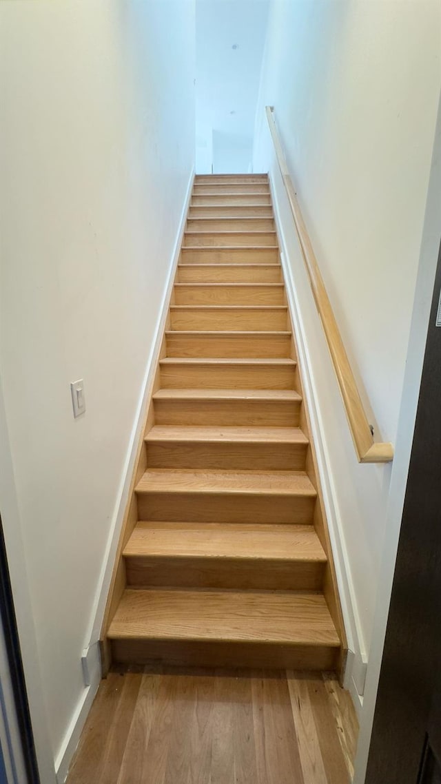 32 Radde Pl, Brooklyn, NY 11233 - staircase featuring wood finished floors and baseboards
