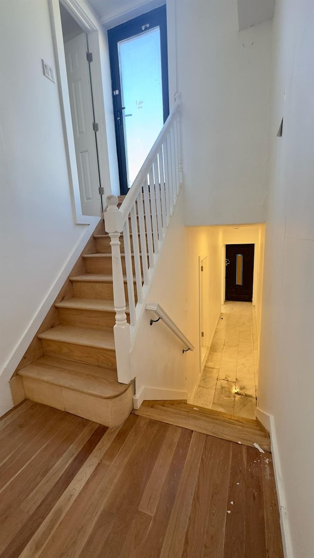 32 Radde Pl, Brooklyn, NY 11233 - staircase featuring hardwood / wood-style floors and baseboards