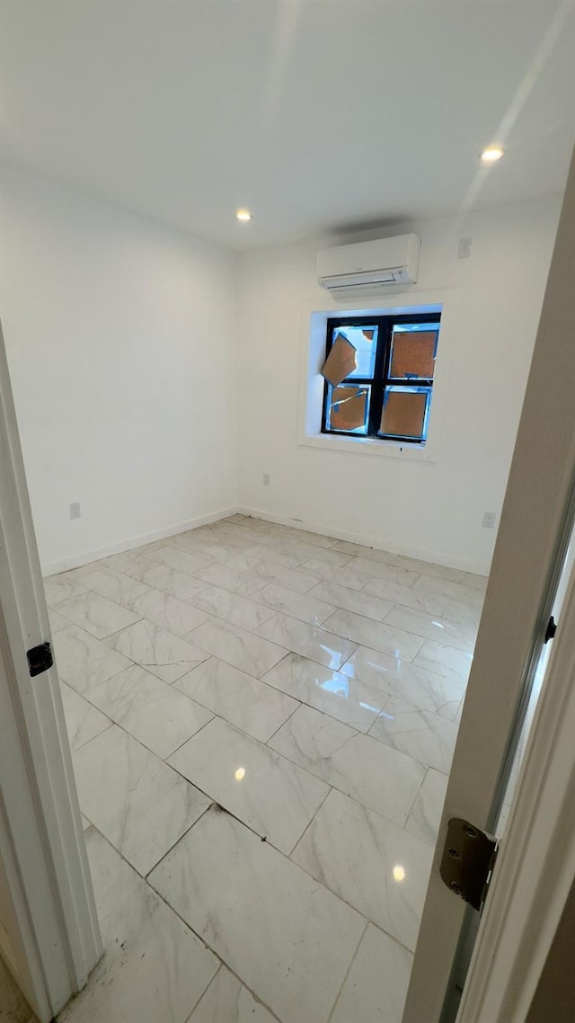 32 Radde Pl, Brooklyn, NY 11233 - spare room featuring a wall mounted air conditioner, light marble finish flooring, and recessed lighting
