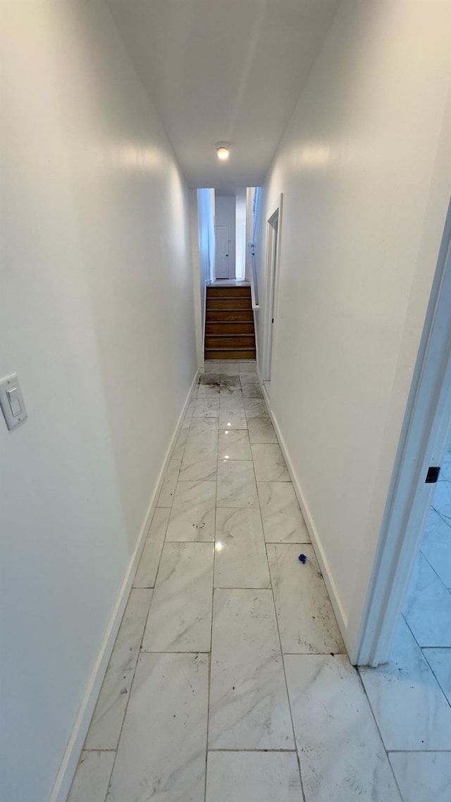 32 Radde Pl, Brooklyn, NY 11233 - hallway with light marble finish flooring and stairway