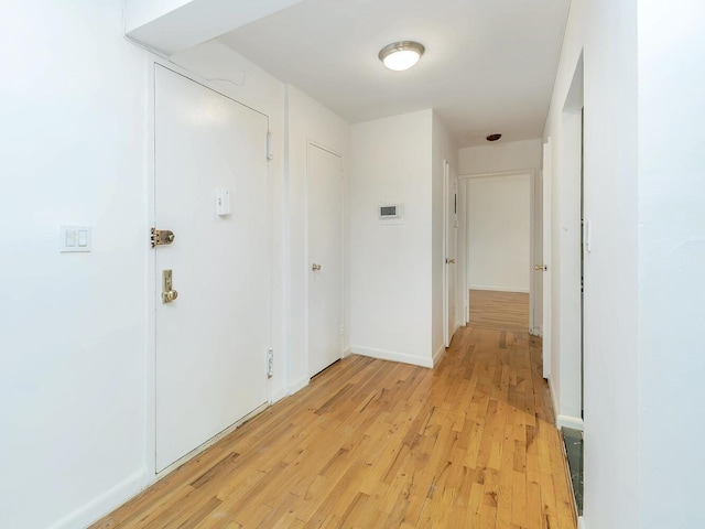 32 Pearsall Ave Unit 3A, Glen Cove, NY 11542 - corridor featuring light wood finished floors and baseboards