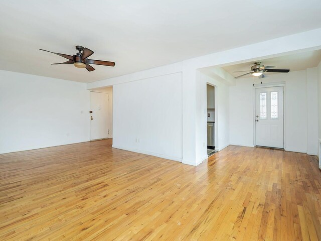 32 Pearsall Ave Unit 3A, Glen Cove, NY 11542 - unfurnished living room with light wood-style floors and ceiling fan