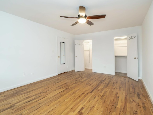 32 Pearsall Ave Unit 3A, Glen Cove, NY 11542 - unfurnished bedroom with light wood finished floors, baseboards, and a ceiling fan