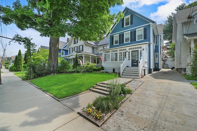 235 Ringgold St, Peekskill, NY 10566 - view of front of house featuring a front yard and concrete driveway