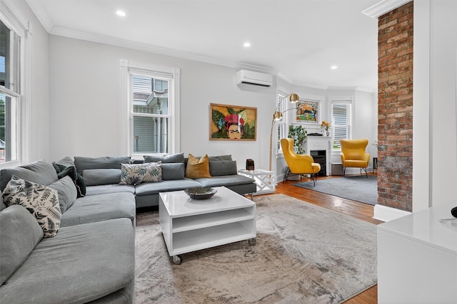 235 Ringgold St, Peekskill, NY 10566 - living room featuring a wall mounted air conditioner, crown molding, wood finished floors, recessed lighting, and a fireplace