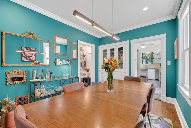 235 Ringgold St, Peekskill, NY 10566 - dining space featuring ornamental molding, wood finished floors, and ceiling fan