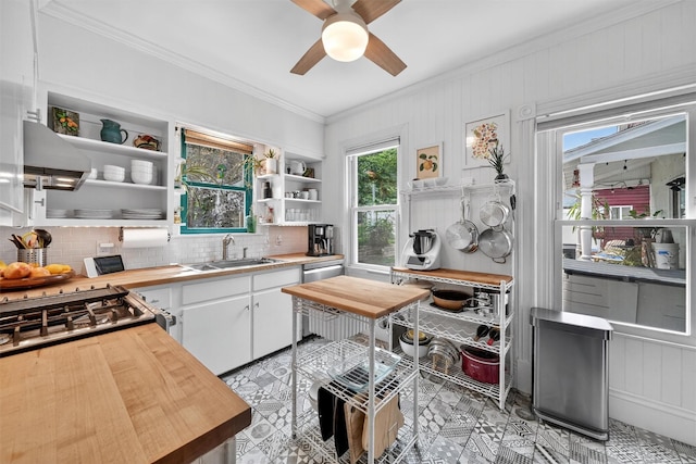 235 Ringgold St, Peekskill, NY 10566 - kitchen with butcher block countertops, range hood, open shelves, ornamental molding, and decorative backsplash