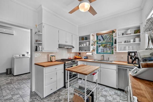 235 Ringgold St, Peekskill, NY 10566 - kitchen with open shelves, stainless steel appliances, washer / dryer, butcher block countertops, and crown molding