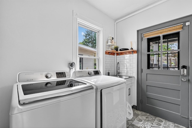 235 Ringgold St, Peekskill, NY 10566 - laundry room featuring cabinet space, separate washer and dryer, and healthy amount of natural light