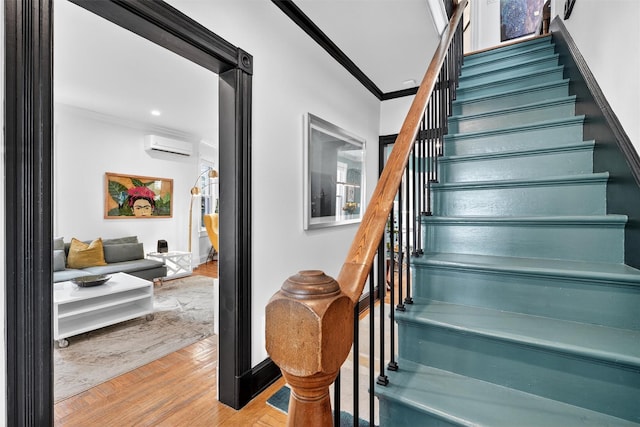 235 Ringgold St, Peekskill, NY 10566 - stairway with crown molding, wood finished floors, and a wall mounted air conditioner