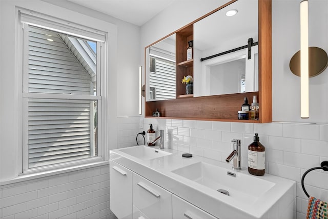 235 Ringgold St, Peekskill, NY 10566 - bathroom with tile walls, double vanity, and wainscoting