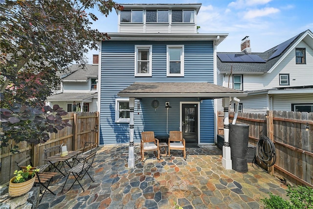 235 Ringgold St, Peekskill, NY 10566 - rear view of house with a patio and a fenced backyard