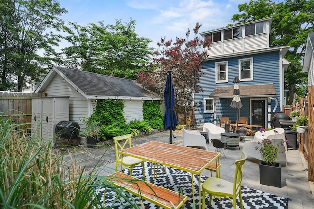235 Ringgold St, Peekskill, NY 10566 - view of patio / terrace with a storage shed, a grill, an outdoor living space, and outdoor dining space