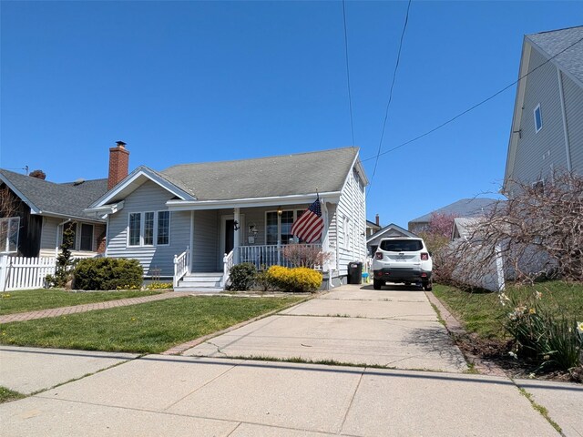 3403 Bay Front Dr, Baldwin, NY 11510 - view of front of property featuring a porch and driveway