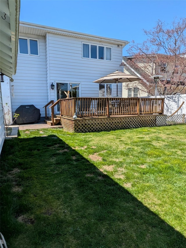 3403 Bay Front Dr, Baldwin, NY 11510 - rear view of property with a lawn and a deck