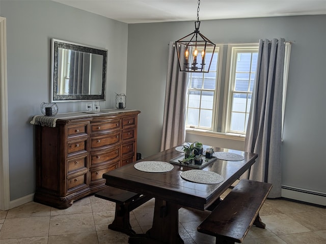 3403 Bay Front Dr, Baldwin, NY 11510 - dining space with a baseboard heating unit, a chandelier, and light tile patterned floors