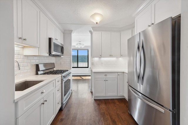 1155 Warburton Ave Unit 12U, Yonkers, NY 10701 - kitchen featuring stainless steel appliances, a sink, light countertops, white cabinets, and a textured ceiling