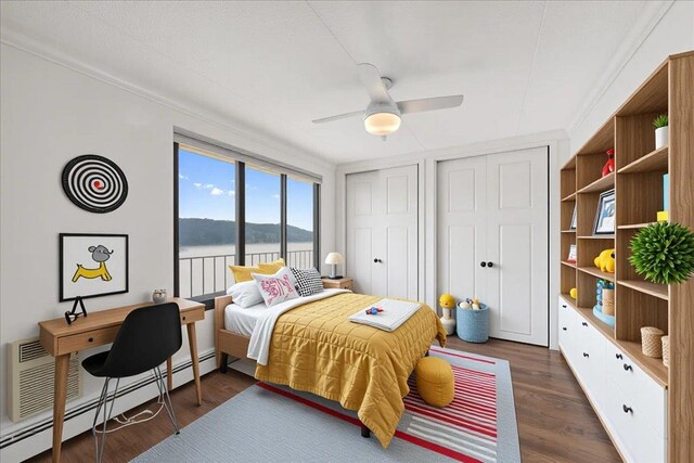 1155 Warburton Ave Unit 12U, Yonkers, NY 10701 - bedroom with a water view, wood finished floors, two closets, and a baseboard radiator