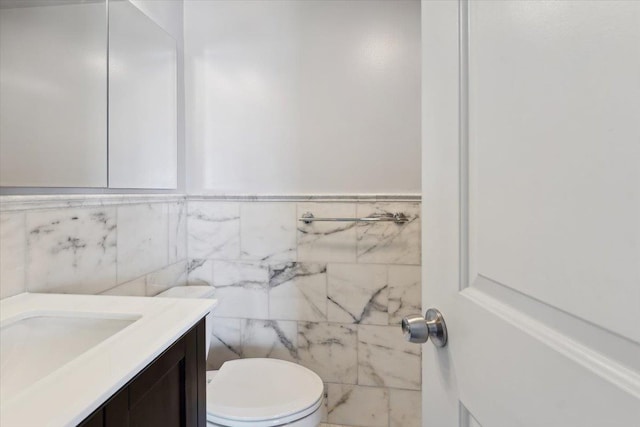 1155 Warburton Ave Unit 12U, Yonkers, NY 10701 - half bathroom with toilet, vanity, tile walls, and wainscoting