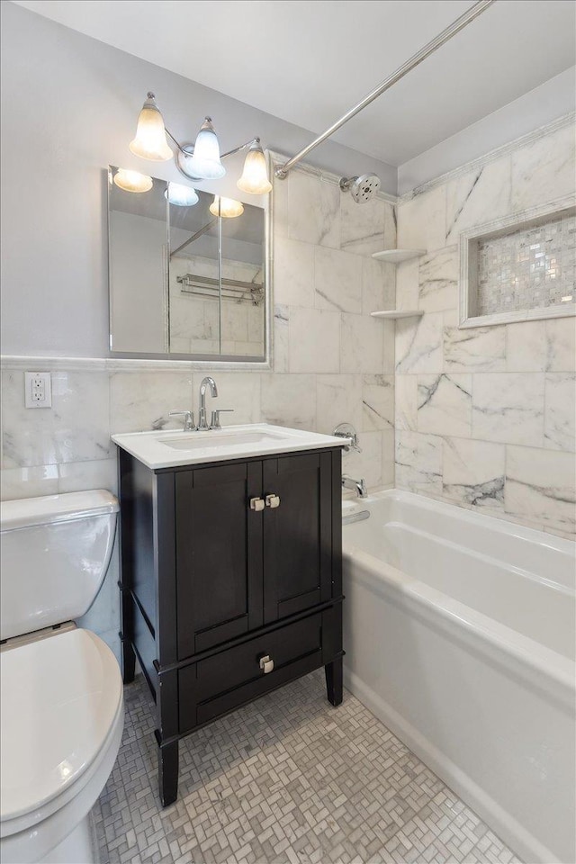 1155 Warburton Ave Unit 12U, Yonkers, NY 10701 - bathroom featuring tile walls, toilet, shower / bath combination, and vanity