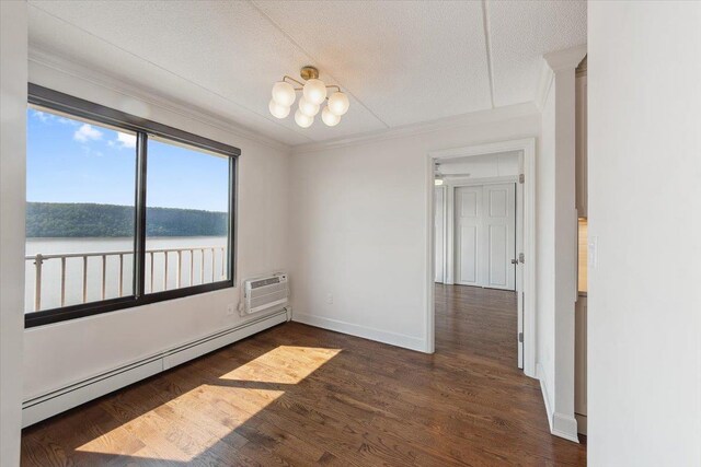 1155 Warburton Ave Unit 12U, Yonkers, NY 10701 - unfurnished room with baseboard heating, ornamental molding, an AC wall unit, wood finished floors, and baseboards