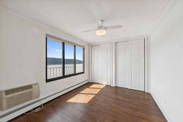 1155 Warburton Ave Unit 12U, Yonkers, NY 10701 - unfurnished bedroom with baseboard heating, crown molding, wood finished floors, baseboards, and a water view