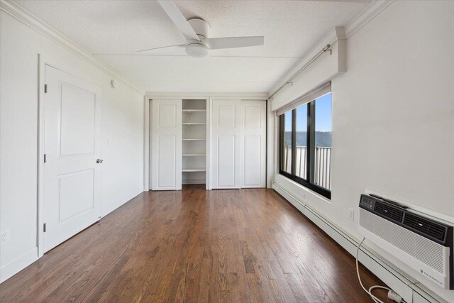 1155 Warburton Ave Unit 12U, Yonkers, NY 10701 - unfurnished bedroom with ornamental molding, wood finished floors, a textured ceiling, a baseboard radiator, and a closet