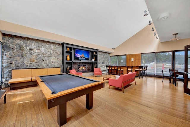 1155 Warburton Ave Unit 12U, Yonkers, NY 10701 - playroom with high vaulted ceiling, billiards table, rail lighting, wood finished floors, and a lit fireplace