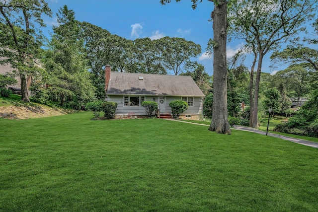 39 Dartmouth Rd, Shoreham, NY 11786 - view of front of house featuring a front yard and a chimney