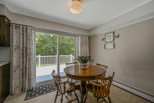 39 Dartmouth Rd, Shoreham, NY 11786 - dining space with baseboard heating and ornamental molding