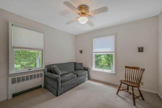 39 Dartmouth Rd, Shoreham, NY 11786 - sitting room featuring radiator heating unit, plenty of natural light, carpet floors, and a ceiling fan