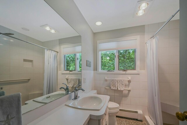 39 Dartmouth Rd, Shoreham, NY 11786 - full bathroom featuring a baseboard radiator, tile walls, toilet, vanity, and a shower with curtain