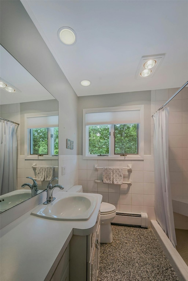 39 Dartmouth Rd, Shoreham, NY 11786 - bathroom featuring a baseboard heating unit, tile walls, toilet, vanity, and tiled shower