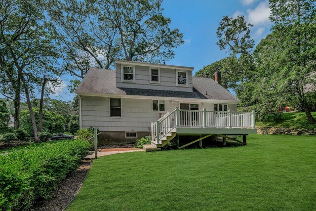 39 Dartmouth Rd, Shoreham, NY 11786 - rear view of house featuring a shingled roof, a wooden deck, a yard, and a chimney