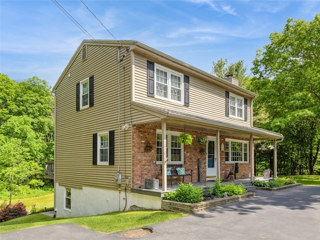 1760 Rte 199, Stanfordville, NY 12581 - view of front of property with covered porch, a chimney, brick siding, and a front yard