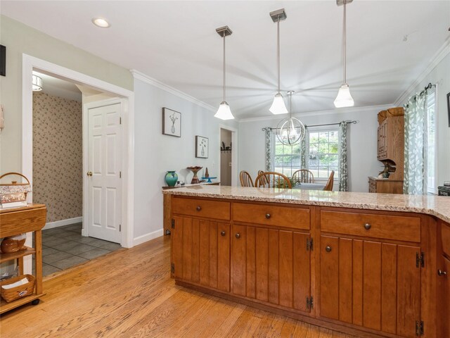 1760 Rte 199, Stanfordville, NY 12581 - kitchen with brown cabinets, light wood-style flooring, hanging light fixtures, ornamental molding, and baseboards