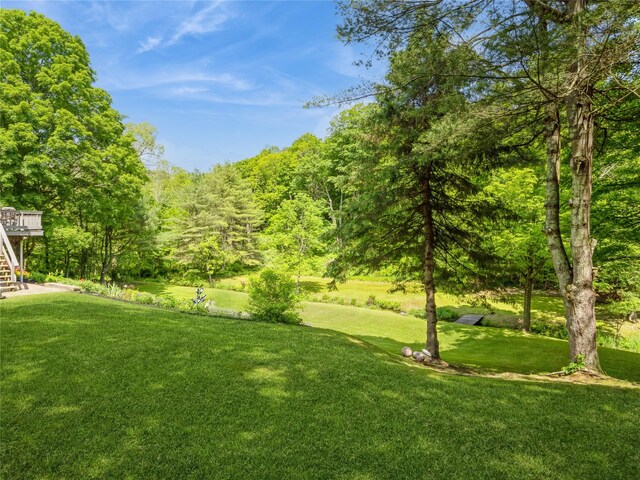 1760 Rte 199, Stanfordville, NY 12581 - view of green lawn with stairs, a deck, and a wooded view