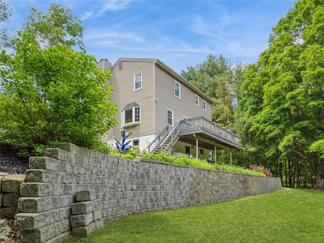 1760 Rte 199, Stanfordville, NY 12581 - back of house with stairway, a wooden deck, a chimney, and a yard