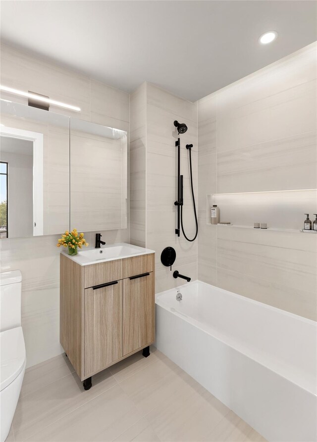 2008 Steinway St Unit 204, Astoria, NY 11105 - bathroom featuring toilet, vanity, shower / bath combination, recessed lighting, and tile patterned floors