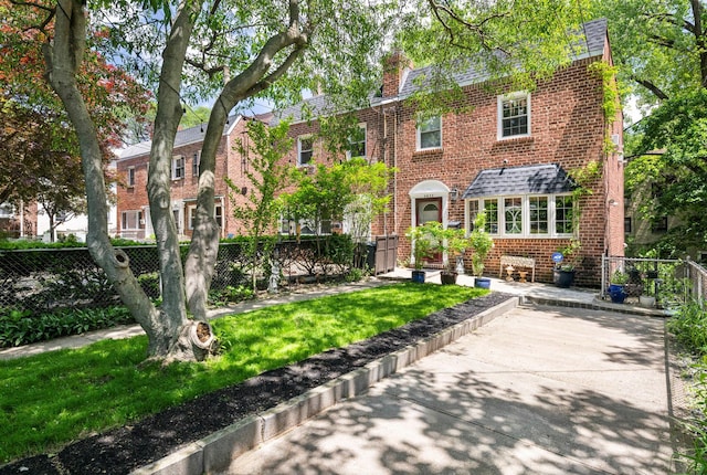 5922 Post Rd, Bronx, NY 10471 - view of front of property with brick siding and a chimney
