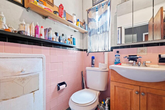 4331 Wilder Ave, Bronx, NY 10466 - half bathroom with toilet, vanity, and tile walls