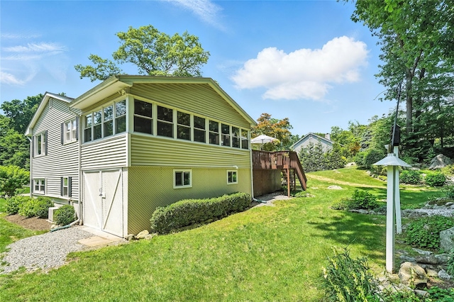 69 Clove Brook Dr, Cold Spring, NY 10516 - view of home's exterior with a deck, stairway, and a lawn