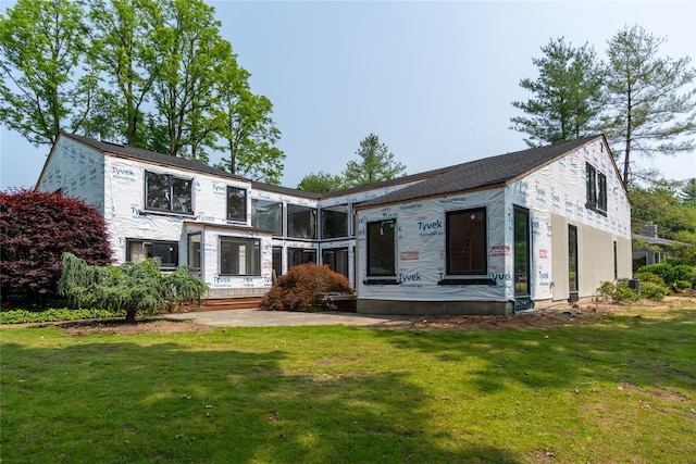 26 Windemere Way, Woodbury, NY 11797 - rear view of property with a lawn