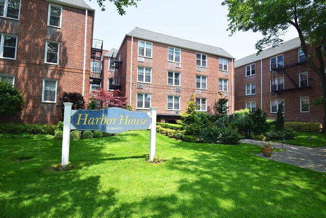 16 Main St Unit 3K, East Rockaway, NY 11518 - view of property's community with a lawn