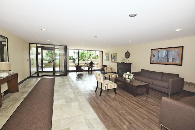 16 Main St Unit 3K, East Rockaway, NY 11518 - common area featuring a wall of windows and recessed lighting