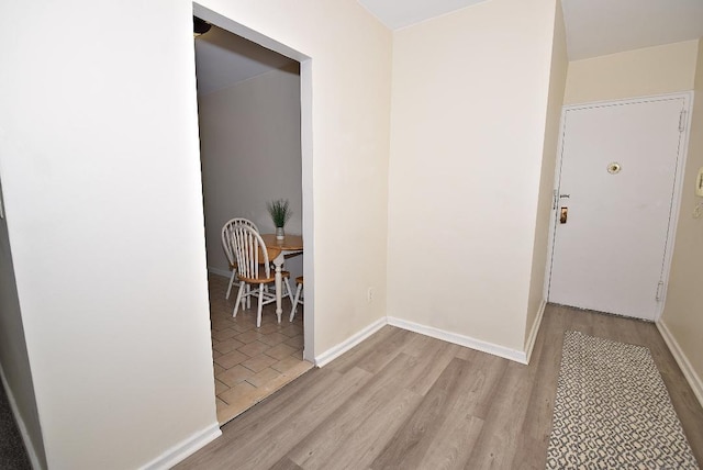 16 Main St Unit 3K, East Rockaway, NY 11518 - corridor featuring wood finished floors and baseboards