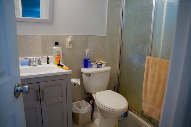 188 N Middletown Rd, Nanuet, NY 10954 - bathroom featuring vanity, a stall shower, toilet, tile walls, and a wainscoted wall